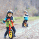 Children riding balance bikes